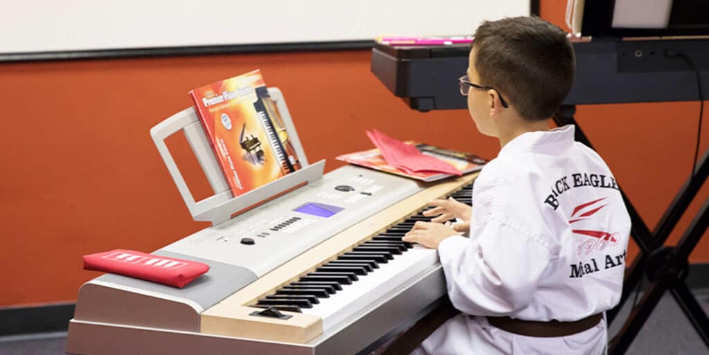 Young child playing keyboard