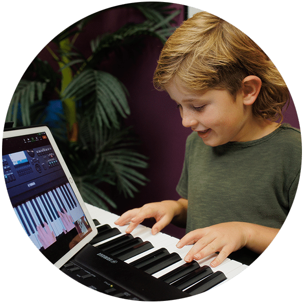 Student playing piano at home during online lesson